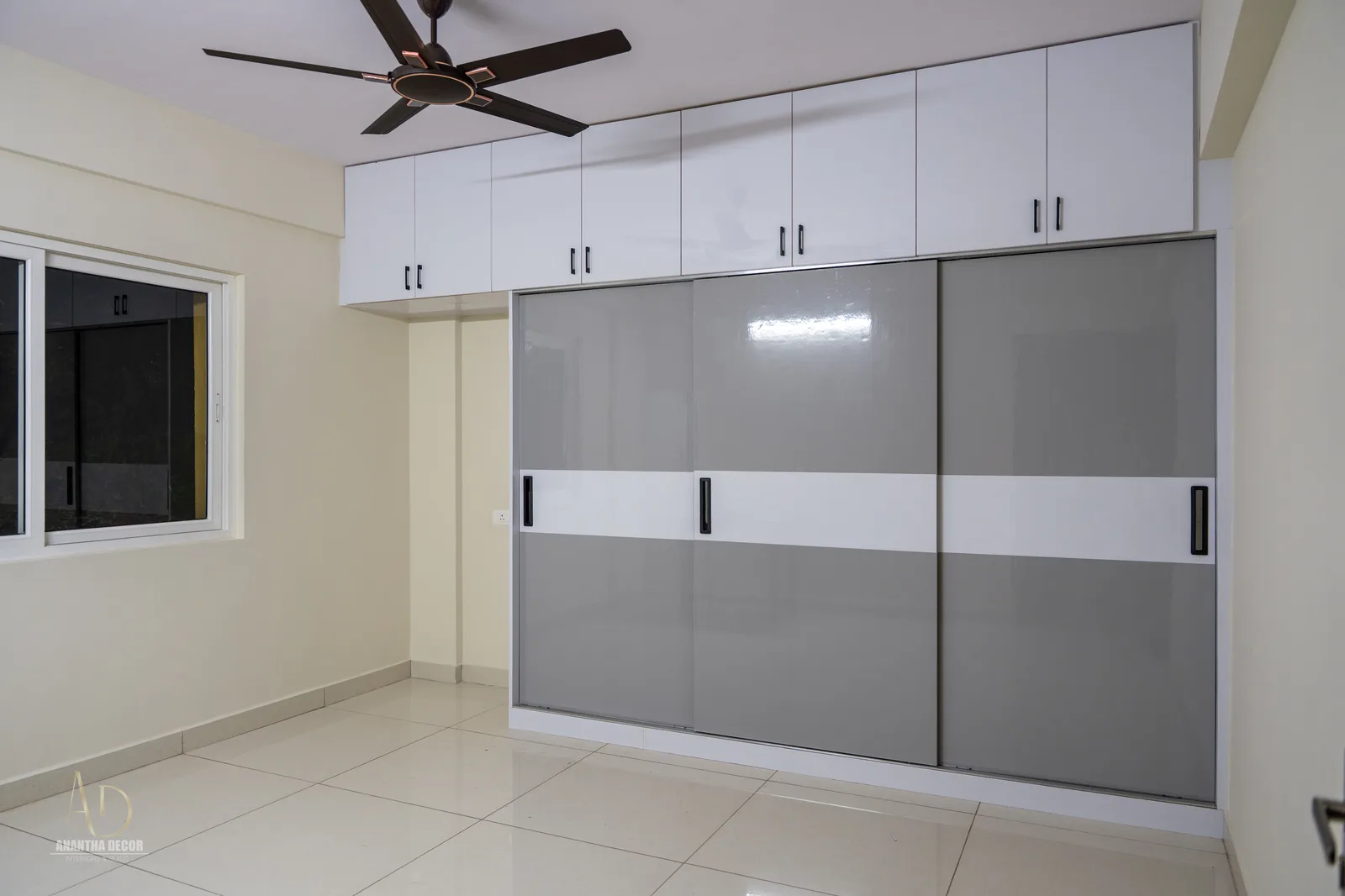 Guest bedroom full-height sliding wardrobe with loft storage