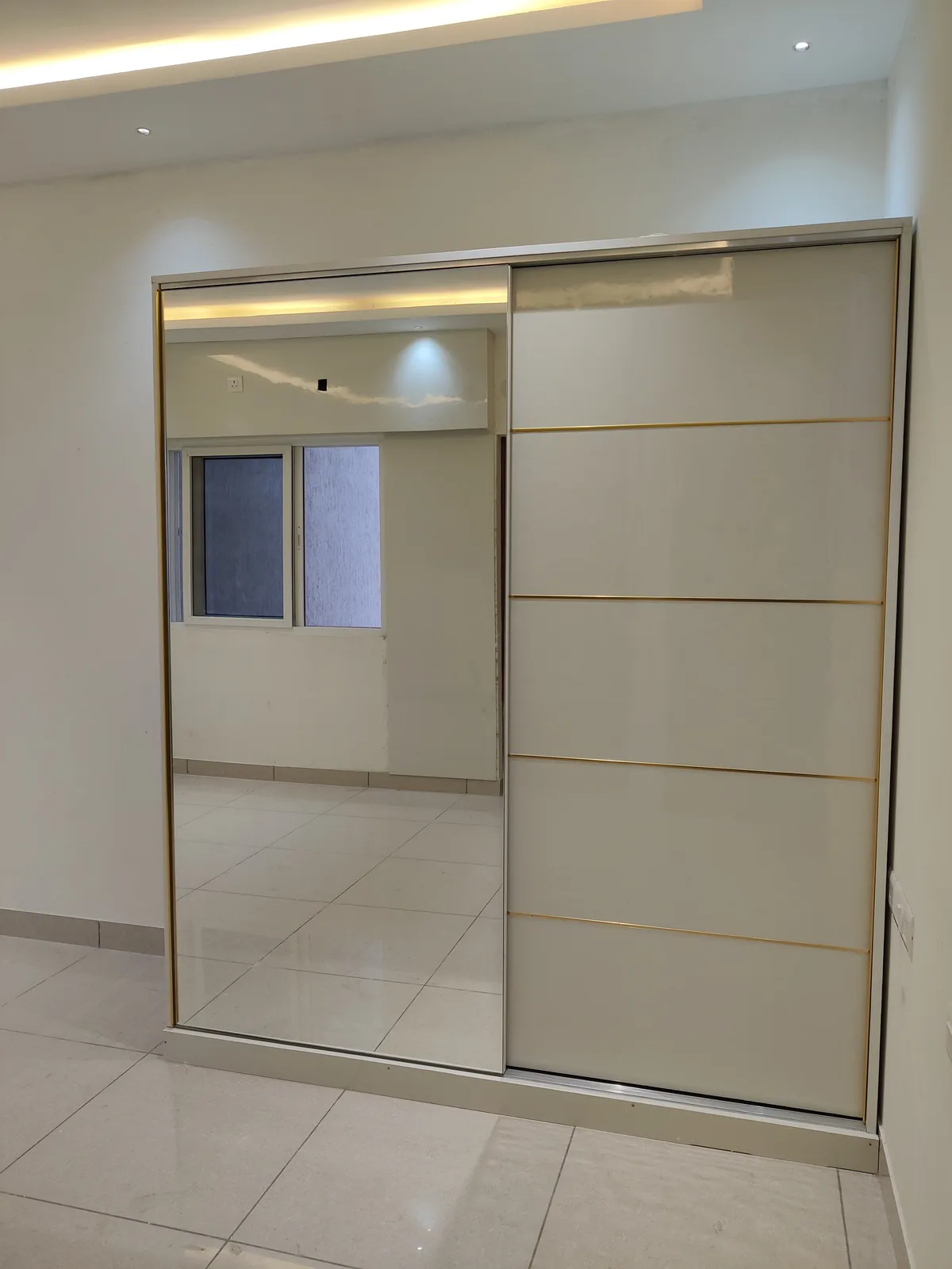 Two-door sliding wardrobe with full-length mirror